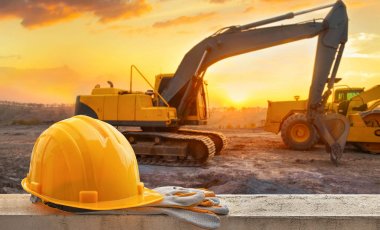 Banner Helm und Bagger im Sonnenuntergang Banner Helm und Bagger im Sonnenuntergang